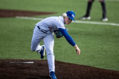 LAWRENCE, KS - 03.06.2025 - right-handed pitcher Cooper Moore #11 of the Kansas Jayhawks during game vs Milwaulkee in Lawrence, KS. Photo by Sydney Allan/Kansas Athletics